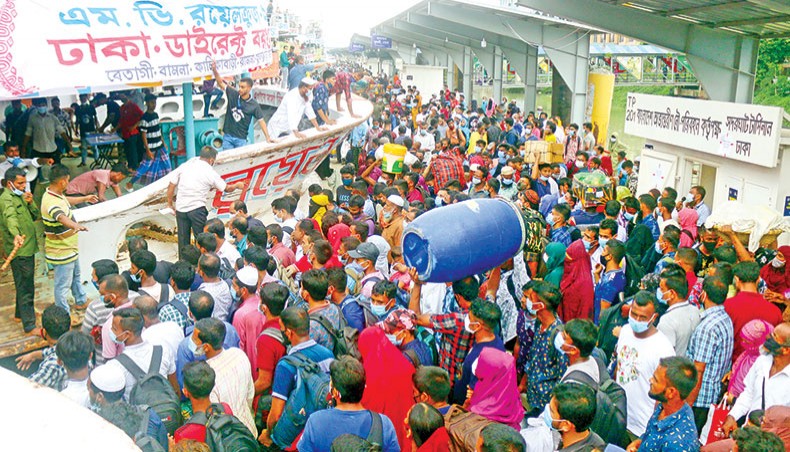Eid-time travellers crowd the Sadarghat launch terminal in Dhaka without bothering about Covid health protocols. — New Age/Sony Ramany